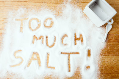 words TOO MUCH SALT handwritten on salt