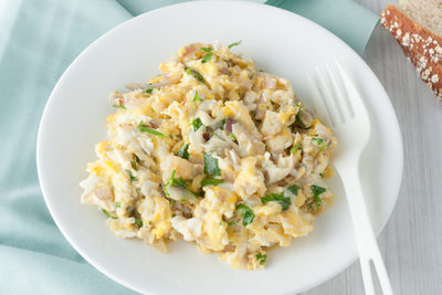 scrambled eggs with fresh herbs and red onion