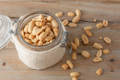 raw peanuts in glass jar