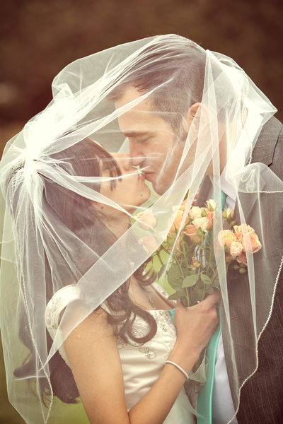 wedding couple kissing under veil in new milford, ct