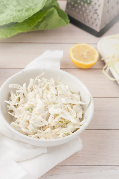 white cabbage cole slaw in white bowl