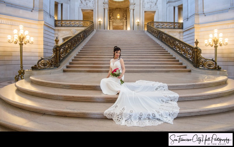 Asian bride sitting on the Grand Staircase at SF City Hall