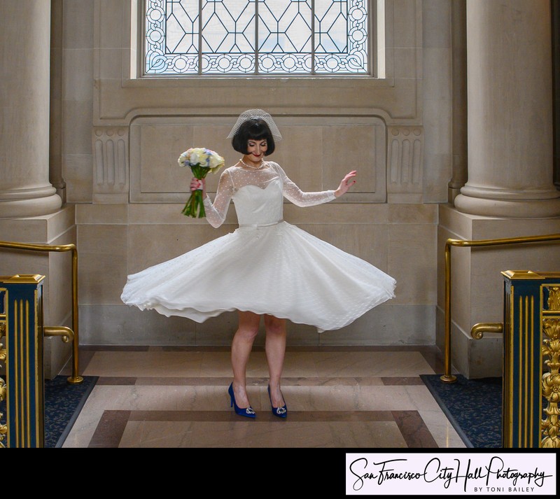 Bride twirling with her wedding dress at SF City Hall