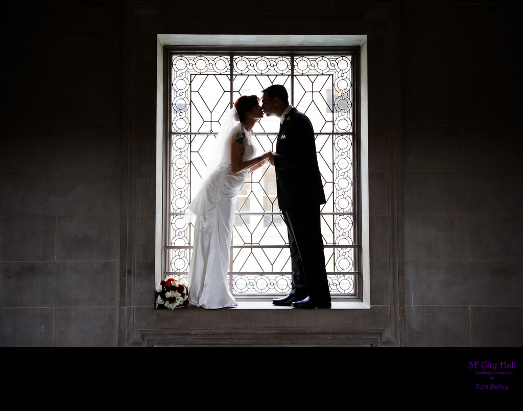San Francisco City Hall Wedding Photographer Romance photo in the window