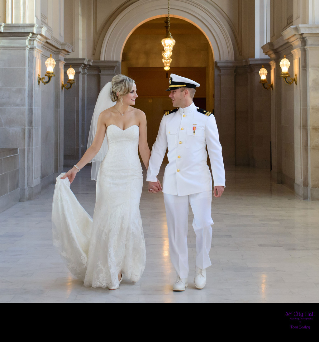 Couple walking in City Hall after their wedding