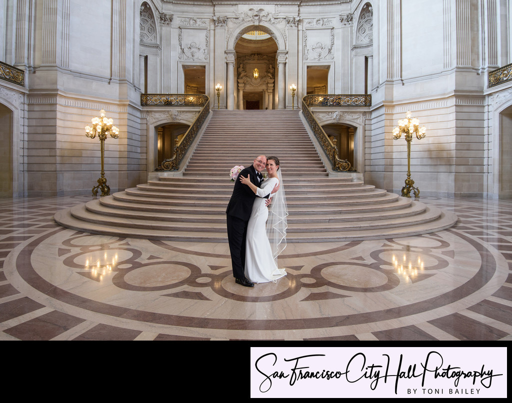 City Hall wedding photography grand staircase with happy couple