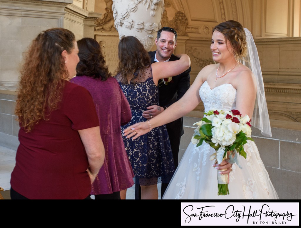 Going in for a hug after sf city hall wedding 