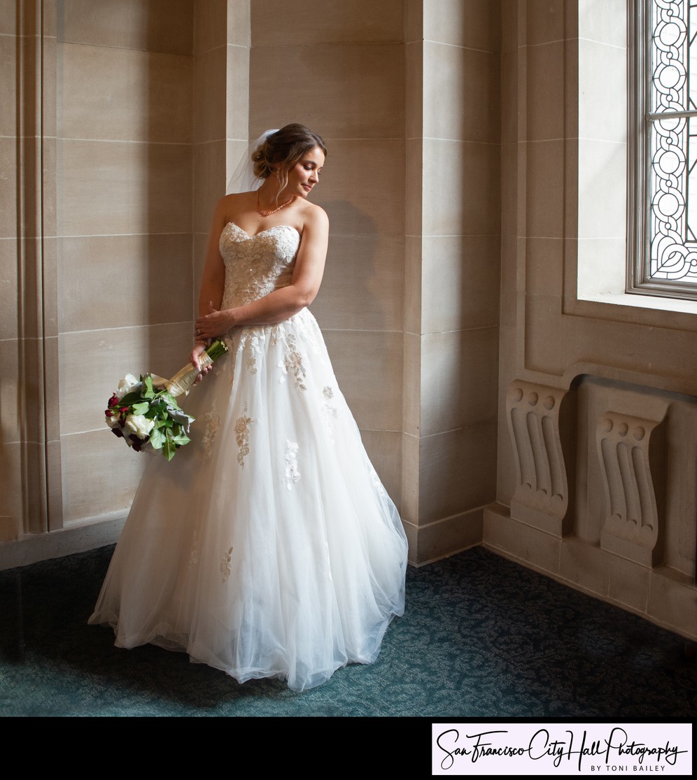 Lovely window light illuminates SF City Hall bride