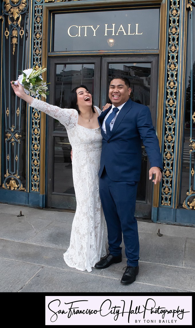 San Francisco City Hall Wedding Couple Laughing outside the entrance