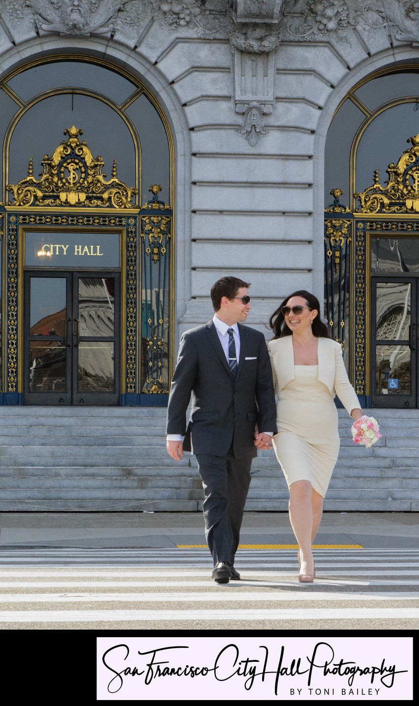 Happy Newlyweds departing SF City Hall - Wedding photography