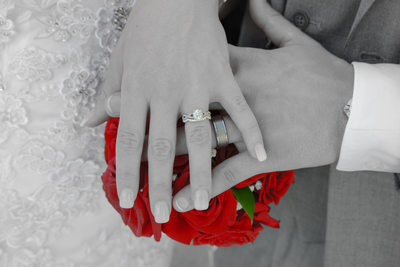 black and white ring photo with red roses