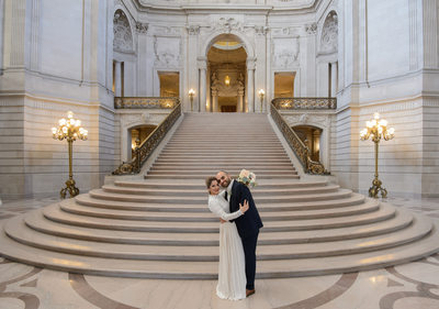 Grand wedding stairs with bride and groom