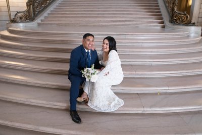 Newlyweds share a laugh at San Francisco city hall - Photography