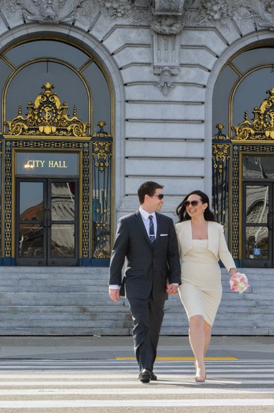 Happy Newlyweds departing SF City Hall - Wedding photography