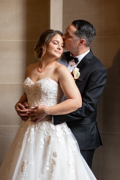 Romantic wedding photography - kiss at city hall