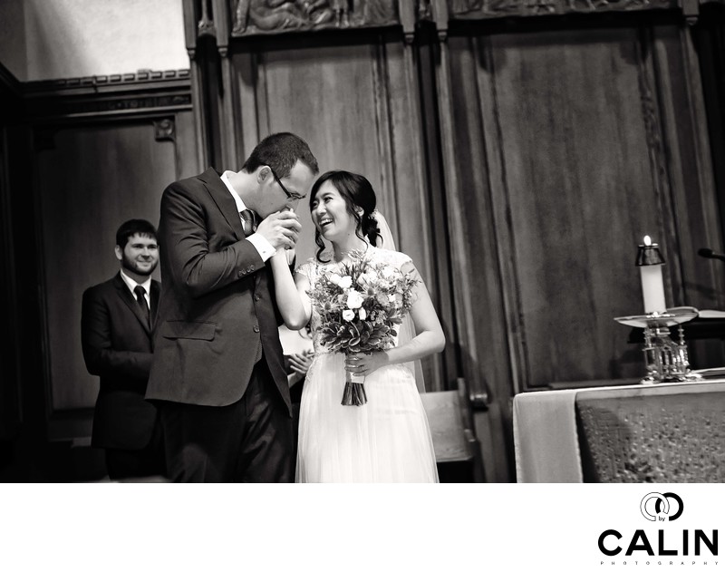 Groom Kisses Bride's Hand at St. Michael's Cathedral Basilica