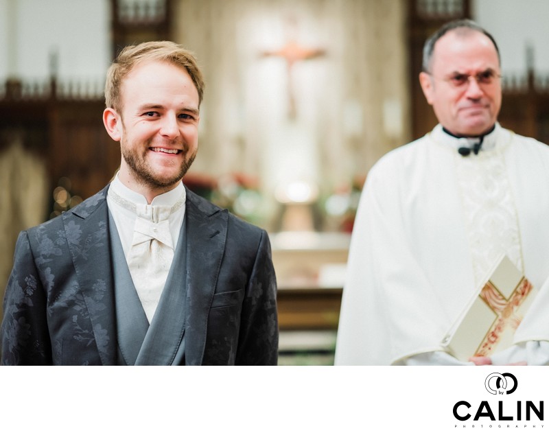 Groom is Watching His Bride Walk Down the Aisle