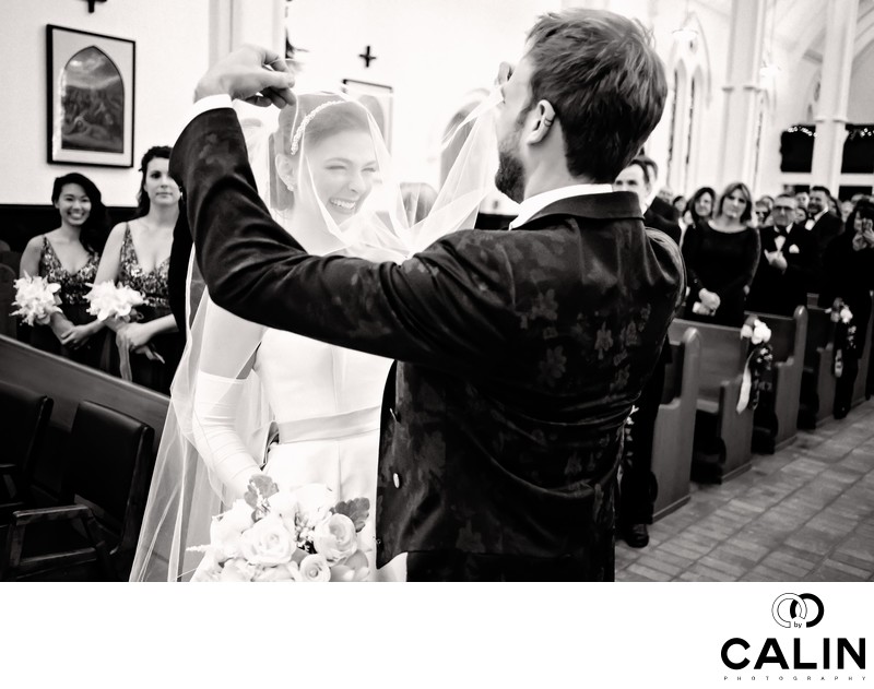 Groom Lifts Bride's Veil