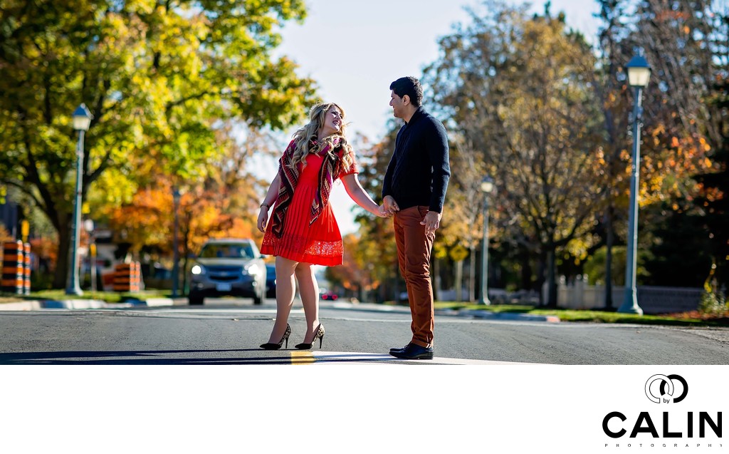 Engagement Photo of Couple Crossing a Stret