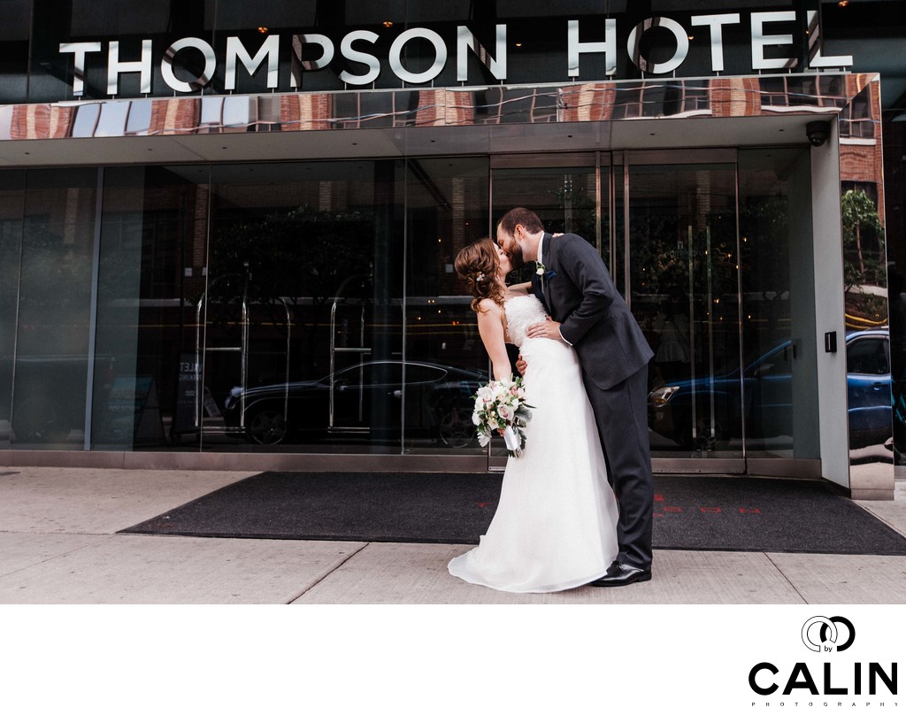 Groom Dips Bride in front of Thompson Hotel Toronto