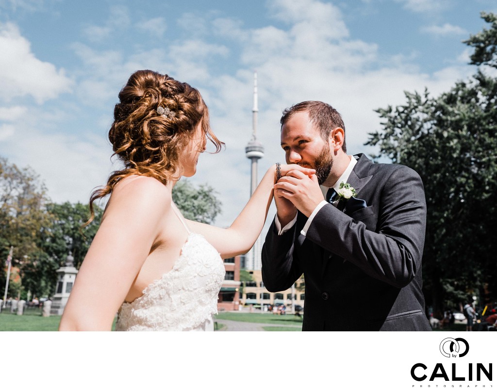 Groom Kisses Bride's Hand at Their Thompson Hotel Toronto Wedding