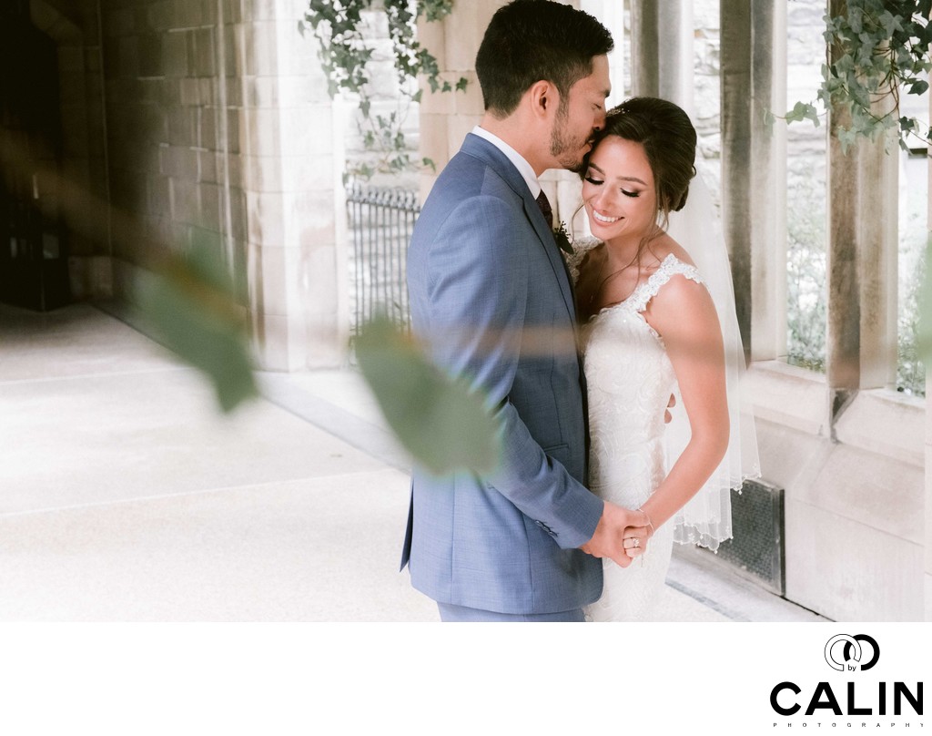 Groom Kisses Bride on the Temple