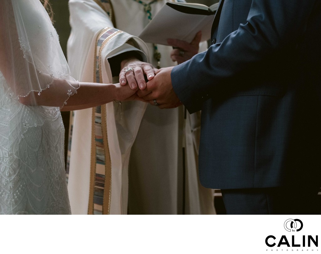 Priest Blesses Bride and Groom
