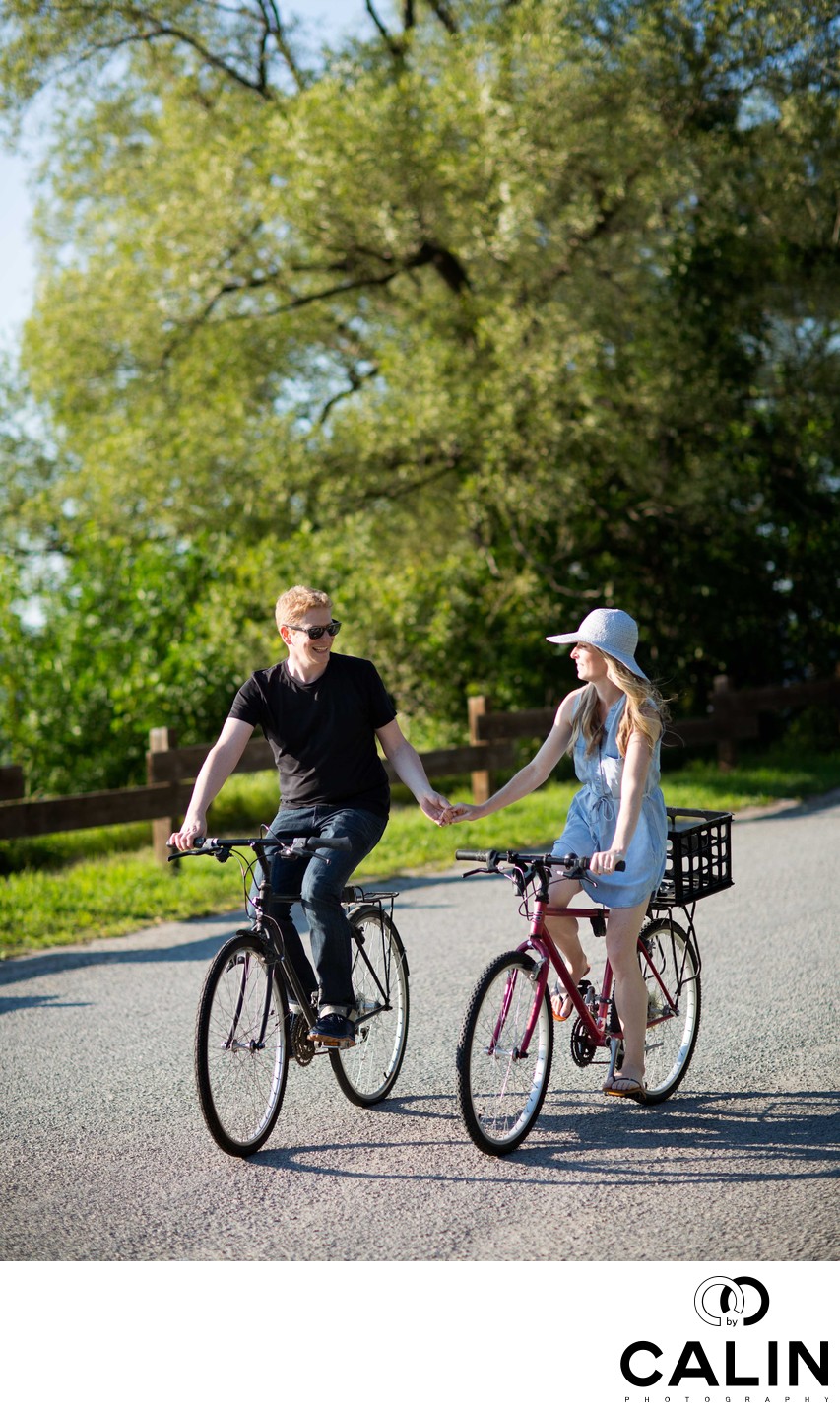 Engagement Photo of a Couple Riding a Bike