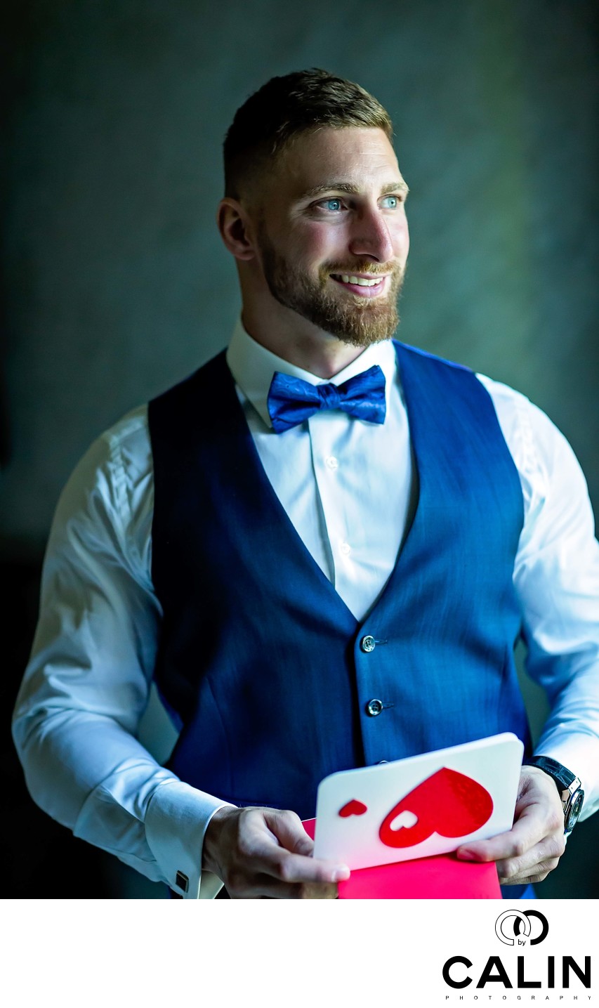 Groom Portrait Holding a Card