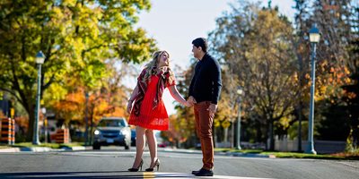 Engagement Photo of Couple Crossing a Stret