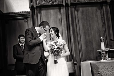 Groom Kisses Bride's Hand at St. Michael's Cathedral Basilica
