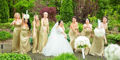 Bridal Party Throw Bouquets at Photographer 