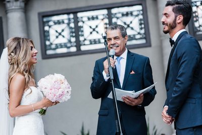 Couple and Officiant Laughing