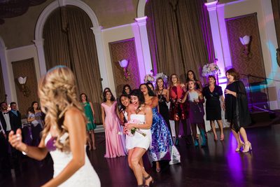 Maid of Honour Catches Bouquet at Liberty Grand Wedding