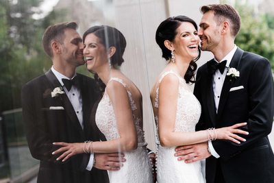 Newlywed Couple Laughs During Storys Building Wedding