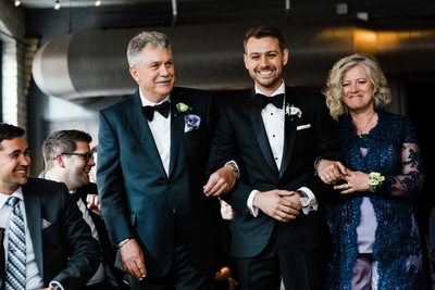 Groom Walks Down the Aisle at Storys Building Wedding