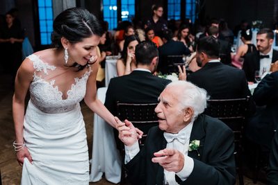 Bride and Grandpa Chat at Storys Building Wedding