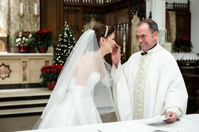 Priest Congratulates Bride