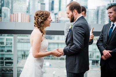 Bride Laughs During Ring Exchange at a Thompson Hotel Toronto Wedding