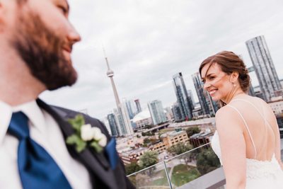 Bride and Groom Flirt on Top of Thompson Hotel Toronto