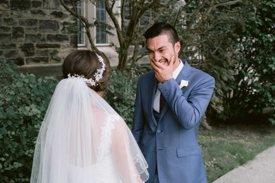 Groom Laughs Looking at the Bride