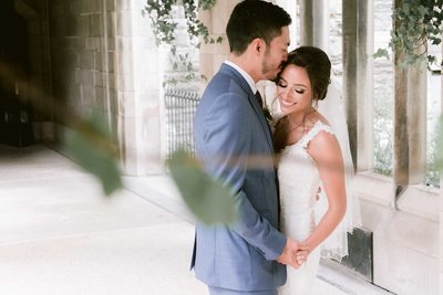 Groom Kisses Bride on the Temple