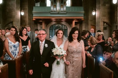 Bride and Parents Walk Down the Aisle
