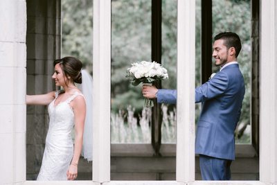 Groom offers the Bouquet to the Bride