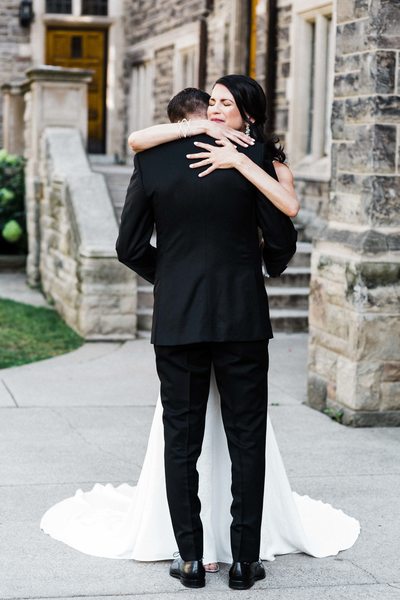 Bride and Groom Hug at Storys Building Wedding