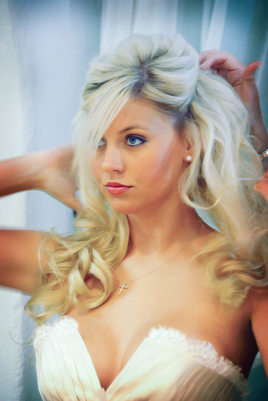 Blonde Bride Fixing Her Hair For Wedding Blonde Bride Fixing Her Hair For Wedding