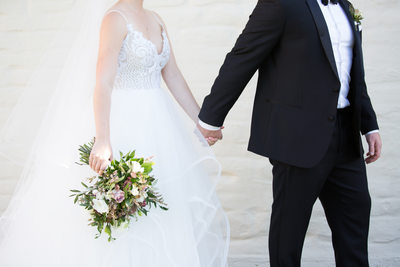 Bride and Groom Walking Hand In Hand 