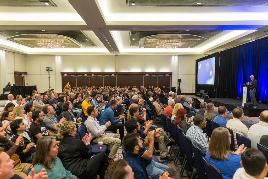 Audience clapping at Perseus Group Constellation conference