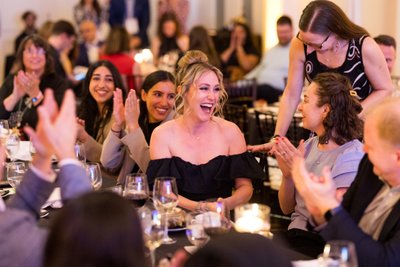 Crowd cheering at auction stanley park teahouse
