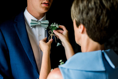 Pinning the Groom's Boutonnière 